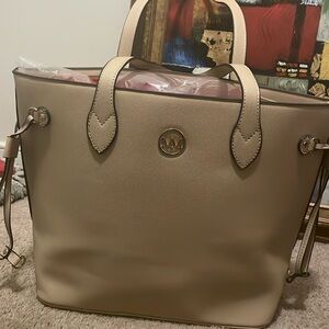 Purse, shoulder bag. Marilyn Monroe. Tan with black trim and red lining. NWOT